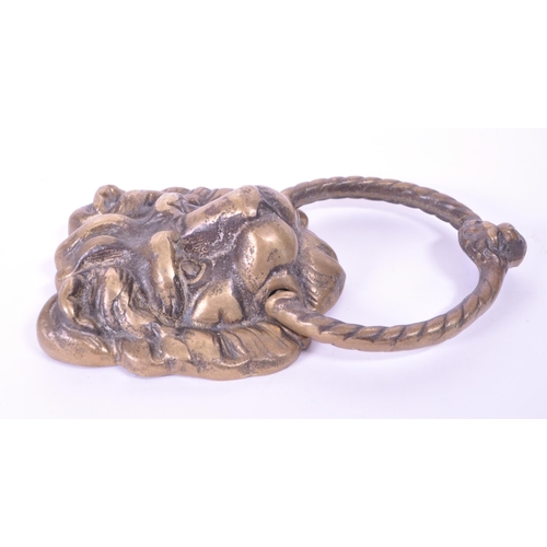 280 - A 19th century Victorian lion brass door knocker. Featuring a lion's head with ring knocker with ano... 