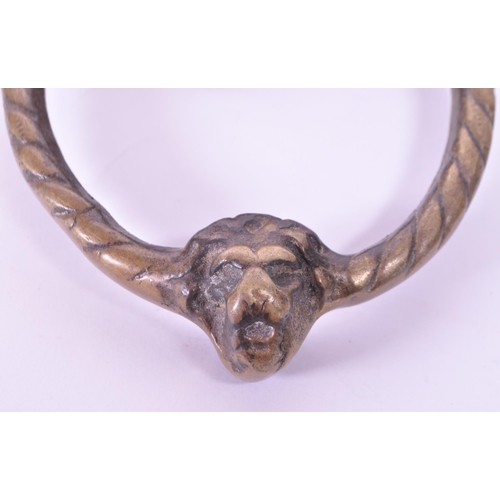 280 - A 19th century Victorian lion brass door knocker. Featuring a lion's head with ring knocker with ano... 