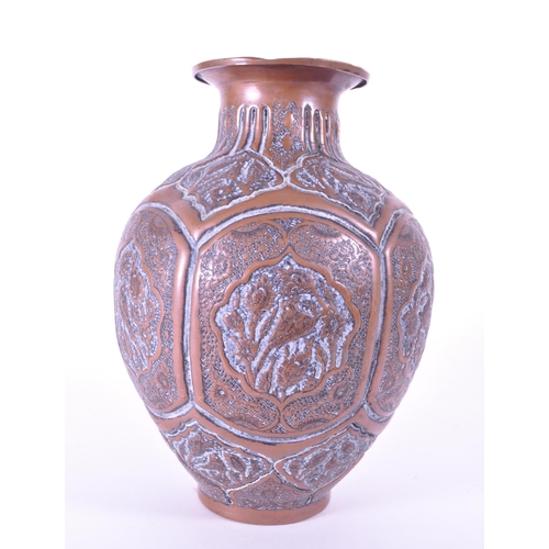 281 - North African early 20th century repousse copper vase. Flared rim into a bulbous body with bird figu... 
