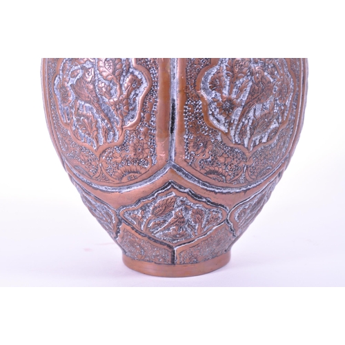 281 - North African early 20th century repousse copper vase. Flared rim into a bulbous body with bird figu... 
