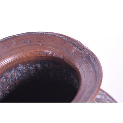 281 - North African early 20th century repousse copper vase. Flared rim into a bulbous body with bird figu... 