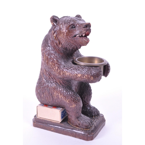 282 - 20th century German black forest wooden carved bear match strike figure with metal bowl match holder... 