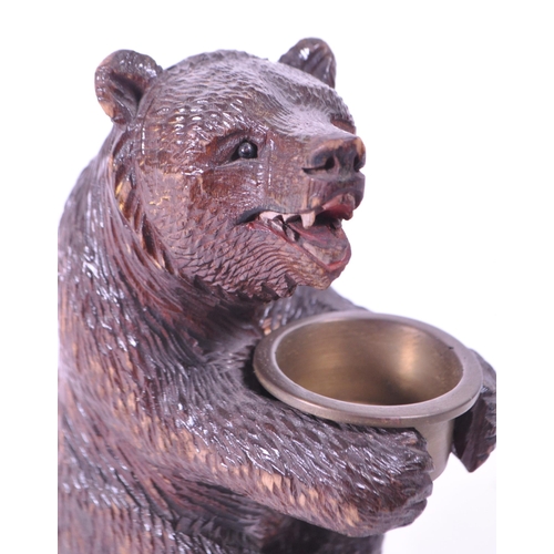 282 - 20th century German black forest wooden carved bear match strike figure with metal bowl match holder... 