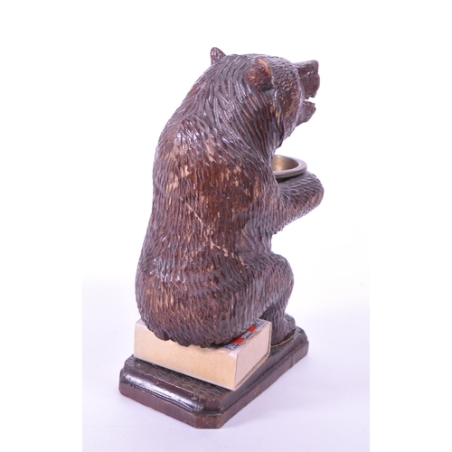 282 - 20th century German black forest wooden carved bear match strike figure with metal bowl match holder... 