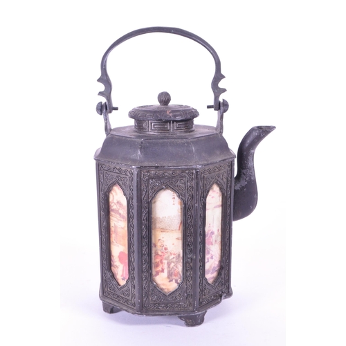 285 - An early 20th century Chinese pewter teapot. Circa 1920s with hand painted panels, swing carry handl... 