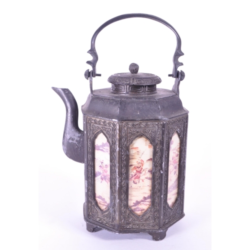 285 - An early 20th century Chinese pewter teapot. Circa 1920s with hand painted panels, swing carry handl... 