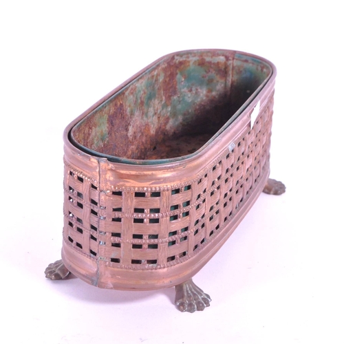 287 - A 19th century small copper planter pierced woven effect raised on lion paw feet. With a rusted meta... 