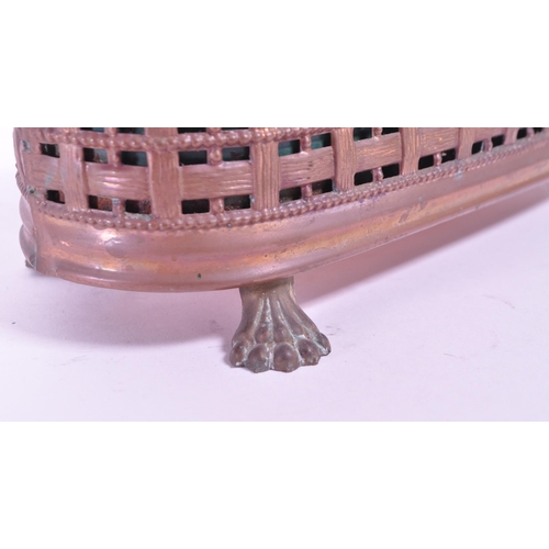 287 - A 19th century small copper planter pierced woven effect raised on lion paw feet. With a rusted meta... 