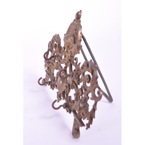 288 - A vintage 20th century brass acanthus leaf table hook stand. With acanthus leaf decoration with fema... 