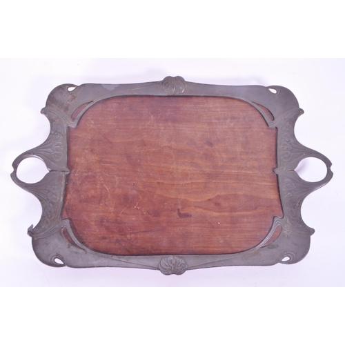 293 - Early 20th century art nouveau style serving tray, comprised of a wooden teak base and pewter moulde... 