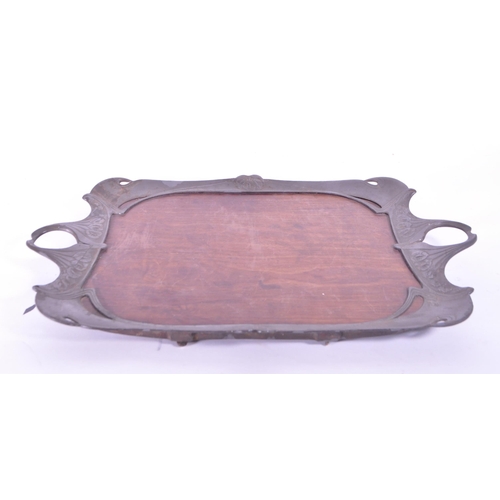 293 - Early 20th century art nouveau style serving tray, comprised of a wooden teak base and pewter moulde... 