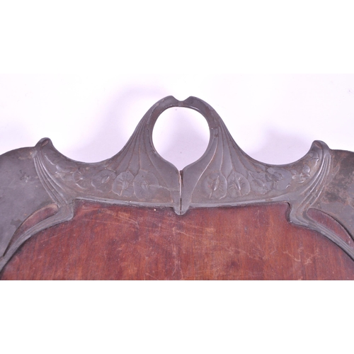 293 - Early 20th century art nouveau style serving tray, comprised of a wooden teak base and pewter moulde... 