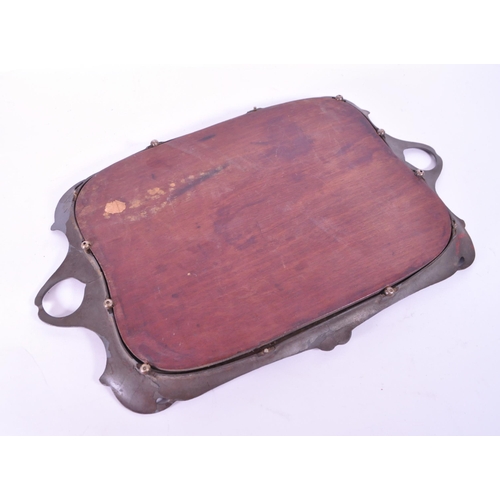 293 - Early 20th century art nouveau style serving tray, comprised of a wooden teak base and pewter moulde... 