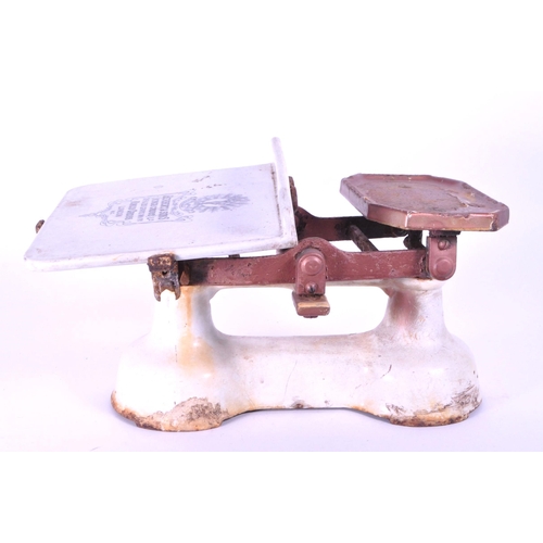 296 - Herbert & Sons - Early 20th century cast iron Kings Cross Ltd weighing scales. Painted in white ... 