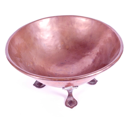 339 - A 19th century copper mixing bowl. Large hammered copper bowl on four wrought iron feet.(15cm x 30cm... 