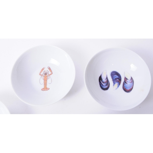 368 - De Limoges - Eight French Richard Bramble porcelain small seafood dishes each decorated with a diffe... 