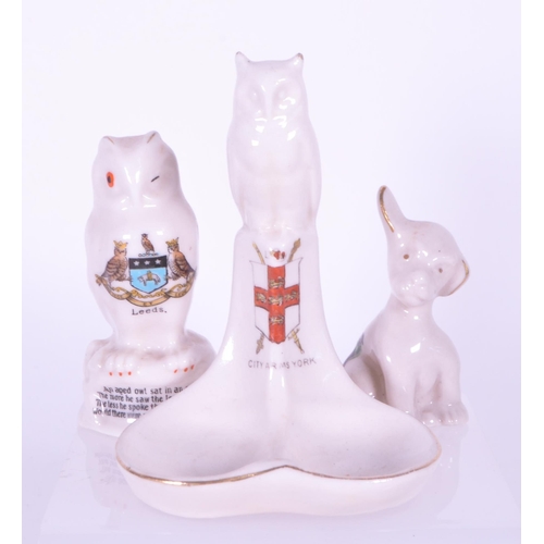 379 - Collection of early 20th century crested china porcelain figures. Makers including Arcadian, T. Lees... 