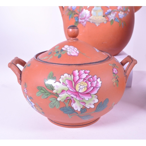 385 - A collection of 19th century Rosso Antico tableware items. To include cloche, water jugs, teapot, tw... 