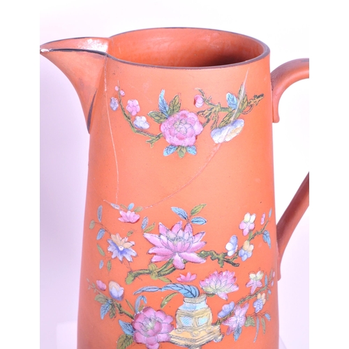 385 - A collection of 19th century Rosso Antico tableware items. To include cloche, water jugs, teapot, tw... 