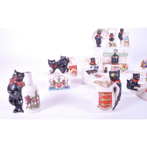 387 - Arcadian - Collection of early 20th century Lucky Black Cat crested china figures. Examples includin... 