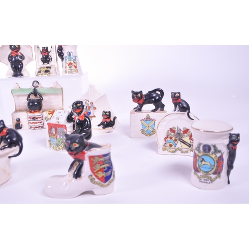 387 - Arcadian - Collection of early 20th century Lucky Black Cat crested china figures. Examples includin... 