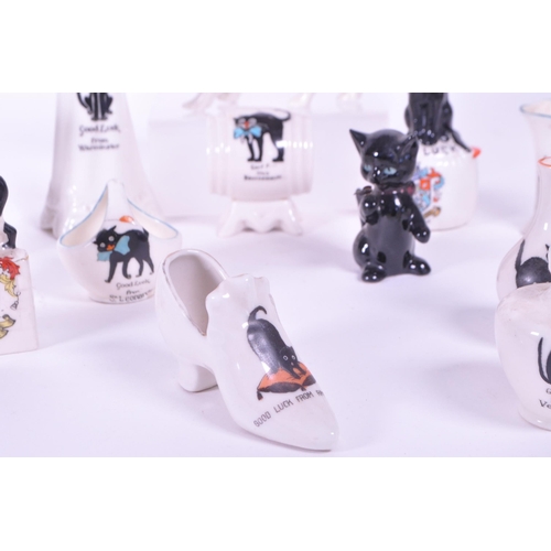 389 - Collection of early 20th century crested china porcelain figures, mostly including a Good Luck greet... 