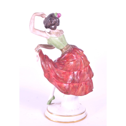 391 - Aelteste Volkstedt - Mid century German porcelain salsa dancer figure, raised on an oval plinth styl... 