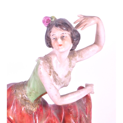 391 - Aelteste Volkstedt - Mid century German porcelain salsa dancer figure, raised on an oval plinth styl... 