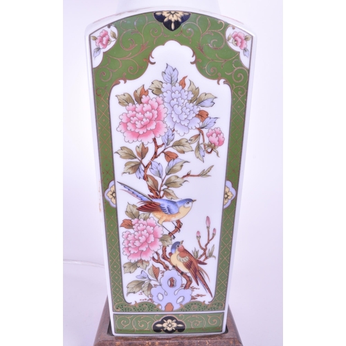 394 - A 20th century Chinese ceramic table lamp vase. Light fixing and shade to top, with garden pattern f... 