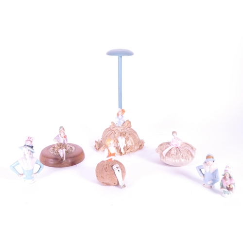 395 - Collection of late 19th century / early 20th century porcelain china doll lady pin cushions, compris... 