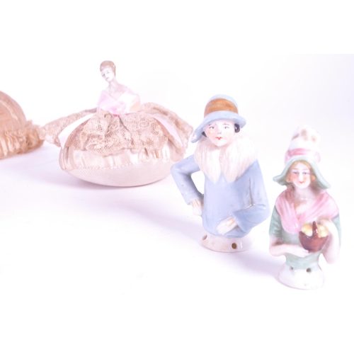 395 - Collection of late 19th century / early 20th century porcelain china doll lady pin cushions, compris... 