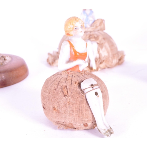 395 - Collection of late 19th century / early 20th century porcelain china doll lady pin cushions, compris... 