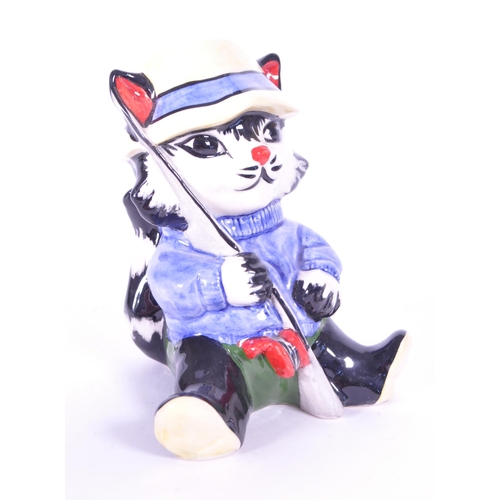 396 - Lorna Bailey (B. 1978) - Two contemporary art deco style ceramic cat figures. Comprised of a fisherm... 