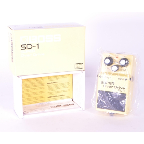 402 - Boss SD-1 super over drive signal processor electric guitar pedal. Housed in an original branded box... 