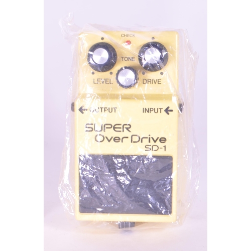 402 - Boss SD-1 super over drive signal processor electric guitar pedal. Housed in an original branded box... 