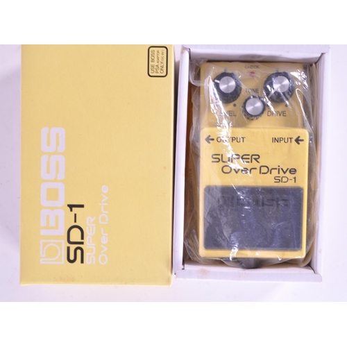 402 - Boss SD-1 super over drive signal processor electric guitar pedal. Housed in an original branded box... 