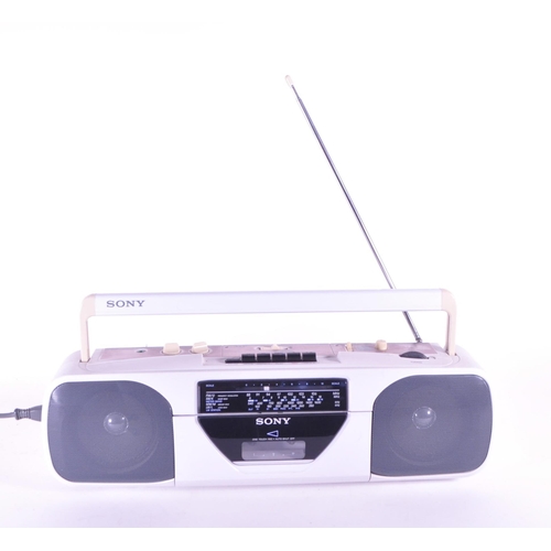 405 - Sony - A vintage 20th century radio cassette-corder. CFS-201L. Stereo speakers with carry handle in ... 