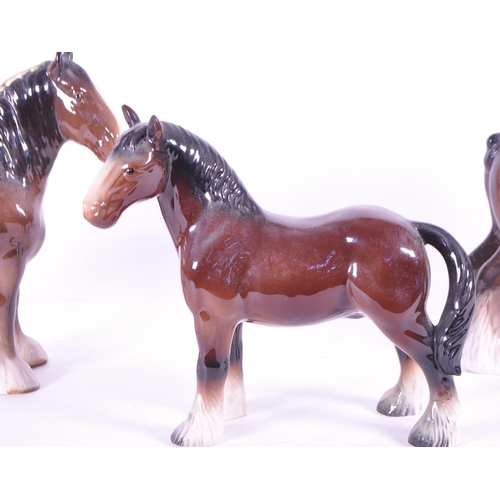 411 - John Beswick - A collection of three china porcelain Shire horse figurine / statues. Two with braids... 