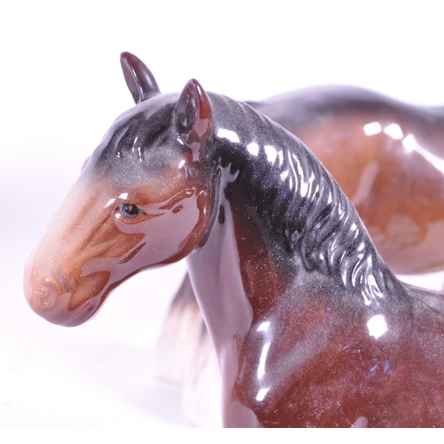 411 - John Beswick - A collection of three china porcelain Shire horse figurine / statues. Two with braids... 