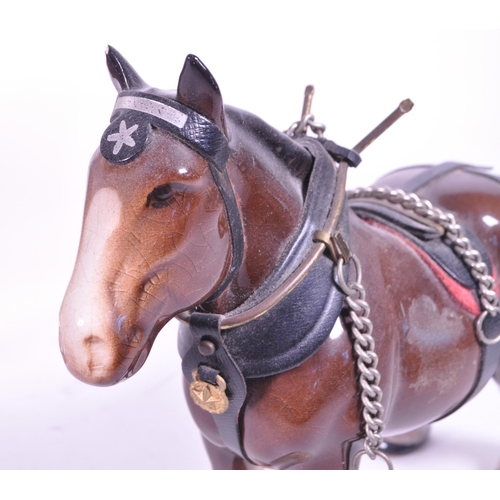 413 - Beswick - Two china porcelain horse figurines. Including Clydesdale Shire horse 2465 in working harn... 