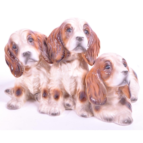 414 - Beswick - A collection of mid century & later porcelain china dog figurines. To include three va... 