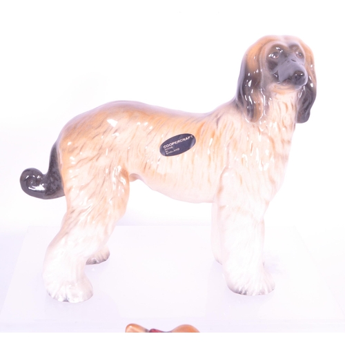 414 - Beswick - A collection of mid century & later porcelain china dog figurines. To include three va... 