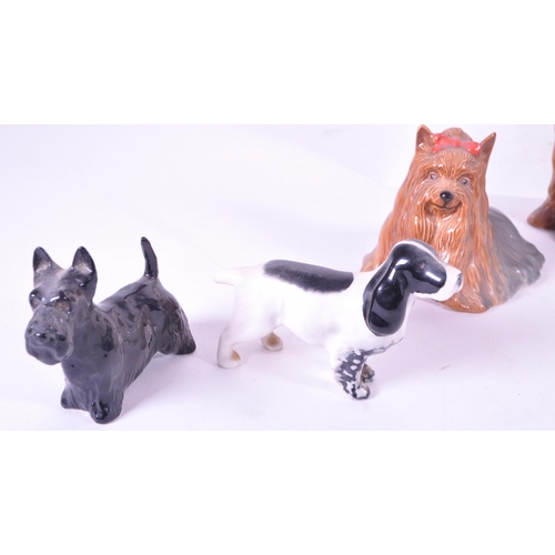414 - Beswick - A collection of mid century & later porcelain china dog figurines. To include three va... 