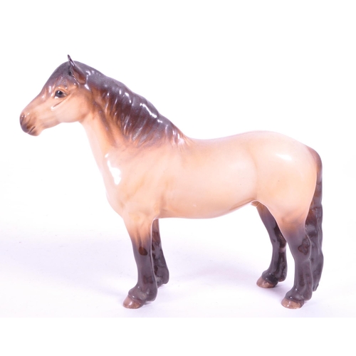 415 - Beswick - A porcelain china Highland Mackionneach Dun pony horse. Standing postion, line to back and... 