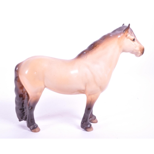 415 - Beswick - A porcelain china Highland Mackionneach Dun pony horse. Standing postion, line to back and... 