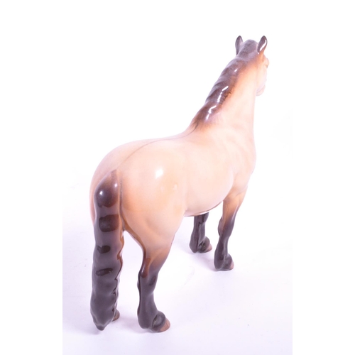 415 - Beswick - A porcelain china Highland Mackionneach Dun pony horse. Standing postion, line to back and... 
