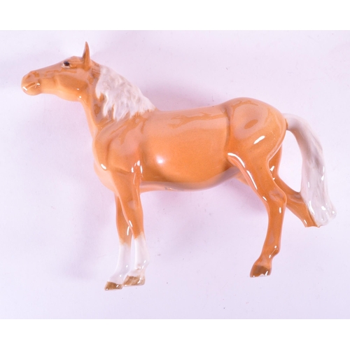 417 - Beswick - A collection of four porcelain china horse figurine / statues. To include a palomino, pran... 