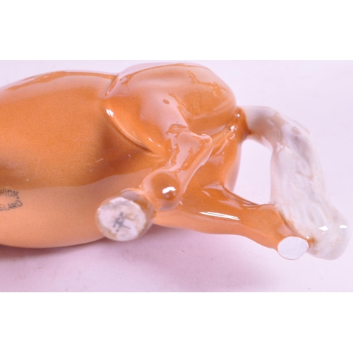 417 - Beswick - A collection of four porcelain china horse figurine / statues. To include a palomino, pran... 