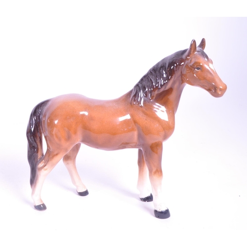 417 - Beswick - A collection of four porcelain china horse figurine / statues. To include a palomino, pran... 