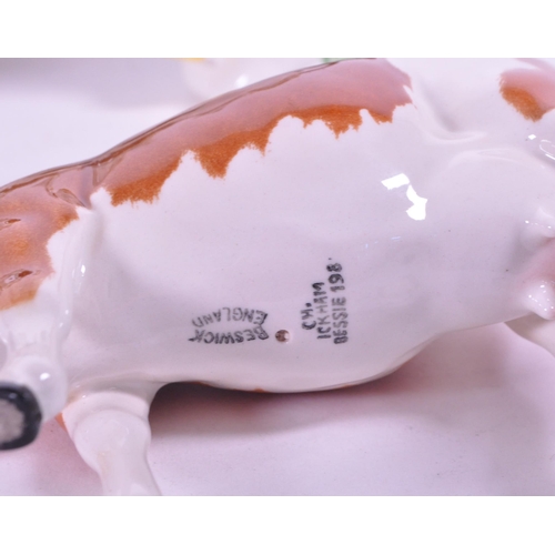 418 - Beswick - A collection of porcelain cow figurines / statues. Three Beswick examples with makers mark... 